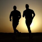 Silhouette of Two Man Running