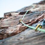 selective focus photo of green climbing safety rope